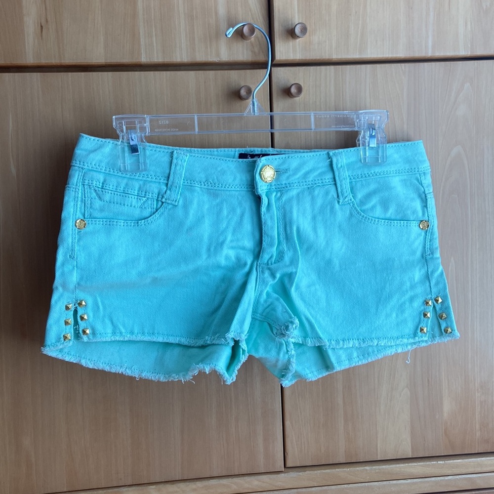 Mint green shorts with gold studs